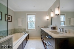 Complete with custom cabinetry and marble tile and countertops. You will love it!