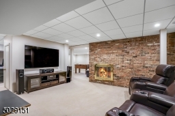 Ok, finished LL with wood burning fireplace accented with a beautiful brick wall, exercise area - and outdoor entrance by the driveway.