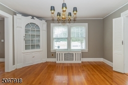 Beautiful hardwood flooring; built-in corner cabinet