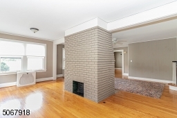 Hardwood flooring; wood-burning fireplace