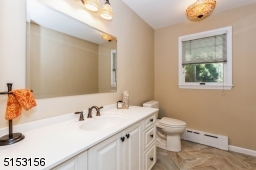 Beautiful new Powder Room, w/herringbone design tile floor.