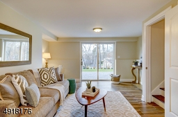 Sliding doors open to the back Paver Patio and large backyard.  There also is a Powder Room and 2nd laundry room on this level.