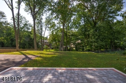 Enjoy a large, deep property - tree-lined and recently terraced.  Plenty of room for play - New landscaping has been added since this photo - must see and appreciate!