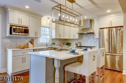 Appliances include Viking stainless steel 6-burner stove, range hood and dishwasher.