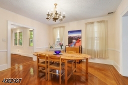 large formal dining room, wood floors with ribbon in-lay