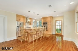 Kitchen view shows French door that leads to the deck