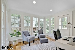 Sunny and cozy sunroom/home office space with walkout to patio