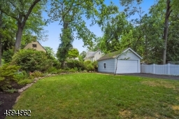 Meticulously landscaped backyard and 2-car detached garage