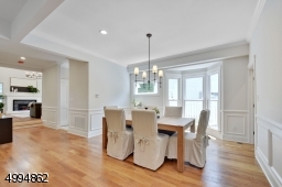 Bright, open concept kitchen/dining room with bay window