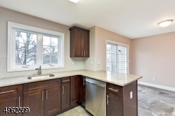 A view of the breakfast bar and enough space for table and chairs