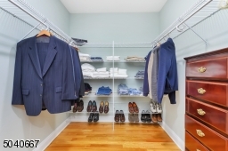 With custom fitted walk-in closet