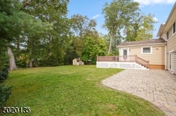 Maintenance free deck and large stone patio.