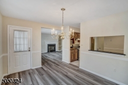 New floors flow throughout Dining Room  which is open to Family Room