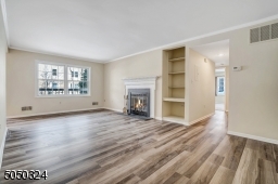 Family Room is so spacious and filled with light....enjoy the glow of the fireplace this winter!