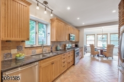 Tons of windows and light in the oversized eat in kitchen.