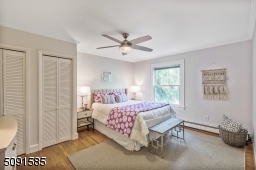 Two closets, two windows and hardwood floors.