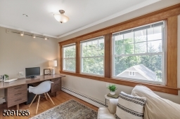 Private office with a wall of windows adjacent to bedroom 4.