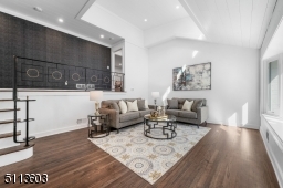 With a two-story shiplap ceiling and tons of light, this living room is a sight to behold.