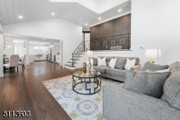 Completely open-concept, with stairs going up to second level, showcased by a beautiful textured navy wall.