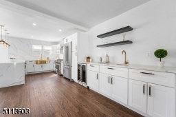 Wet Bar with tons of storage, counter space and a wine refrigerator leads from dining room into gorgeous chef's kitchen!