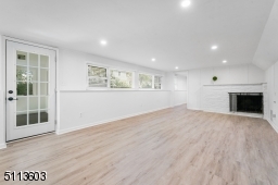 Huge space with wood-burning fireplace can be used as a family room, play room or recreation room!