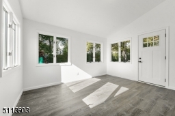 Sun-filled with a vaulted ceiling and exposed brick wall, you will spend four seasons out here!