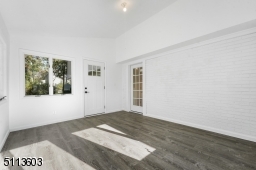 Sun-filled with a vaulted ceiling and exposed brick wall, you will spend four seasons out here!