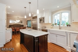 The white carrera marble top with prep sink will make cooking a breeze!