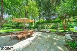 Large bluestone patio & stone walls for additional seating