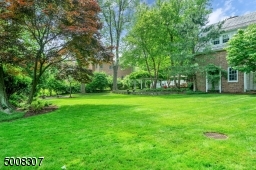Large level lush property with 3 bluestone patios