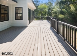 Large Trex deck off of kitchen and den