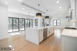 Alternate view of eat in kitchen open to den.
