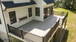 Large deck off kitchen and den.