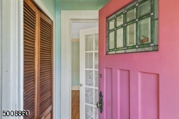 A beautiful stained glass window and large coat closet in the entryway welcomes guests.