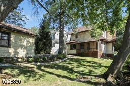 Expansive back yard and two car detached garage complete the property.