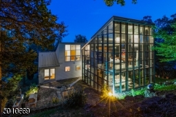 Contemporary Gem in Millburn with a 28 ft glass and steel addition and the South Mountain Reservation in your backyard!