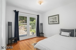 Contemporary Gem in Millburn with a 28 ft glass and steel addition and the South Mountain Reservation in your backyard!