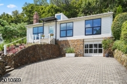 Contemporary Gem in Millburn with a 28 ft glass and steel addition and the South Mountain Reservation in your backyard!