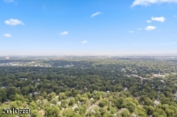 Contemporary Gem in Millburn with a 28 ft glass and steel addition and the South Mountain Reservation in your backyard!