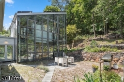 Contemporary Gem in Millburn with a 28 ft glass and steel addition and the South Mountain Reservation in your backyard!
