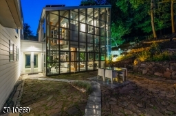 Contemporary Gem in Millburn with a 28 ft glass and steel addition and the South Mountain Reservation in your backyard!