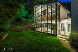 Contemporary Gem in Millburn with a 28 ft glass and steel addition and the South Mountain Reservation in your backyard!