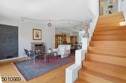 Contemporary Gem in Millburn with a 28 ft glass and steel addition and the South Mountain Reservation in your backyard!