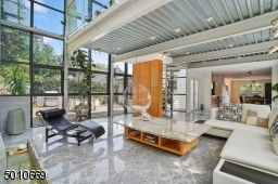 Contemporary Gem in Millburn with a 28 ft glass and steel addition and the South Mountain Reservation in your backyard!