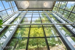 Contemporary Gem in Millburn with a 28 ft glass and steel addition and the South Mountain Reservation in your backyard!