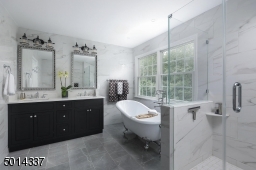 Featuring soaking tub and frameless shower