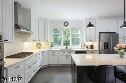 Featuring top-of-the-line appliances and quartz countertops