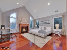 Primary bedroom featured with cathedral ceiling, gas fireplace, walk in closet, oversized ensuite.