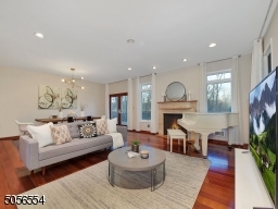 Family Room with large Andersen windows, gas fireplace, connected to private deck and backyard