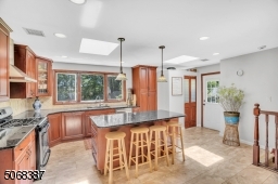 Stainless Appliances, Center Island, Large Windows & Skylight
